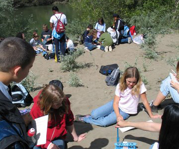 class working on the beach